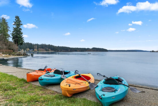 Four kayaks on a beach in daylight