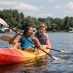 A couple smiles while kayaking