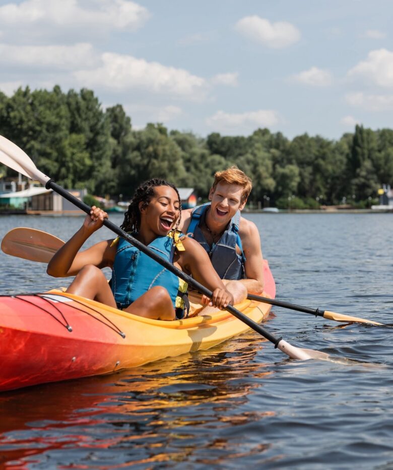 A couple smiles while kayaking